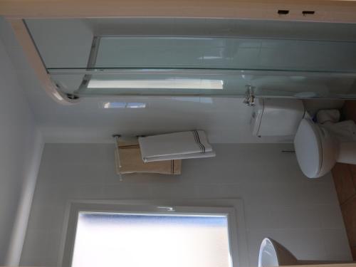 a small bathroom with a toilet and a window at Appartement Banyuls-sur-Mer, 3 pièces, 5 personnes - FR-1-309-58 in Banyuls-sur-Mer