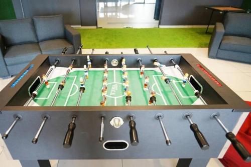 a table that has a table with a soccerificialificialificialificialificialificialificial at The Icon2 Condo in IOI City Mall Putrajaya, Pool View in Putrajaya