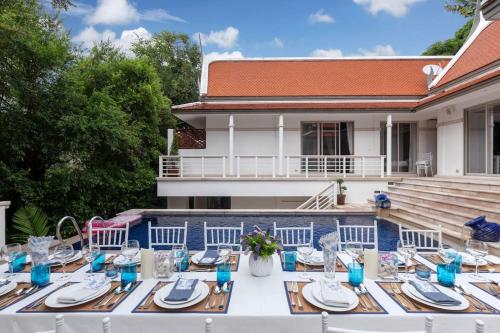 a table with blue and white dishes on it at Katamanda 3 Bed Tropical Villa B3 Near Kata Beach in Kata Beach