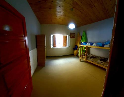 Ένα ή περισσότερα κρεβάτια σε δωμάτιο στο Hostel Paraíso