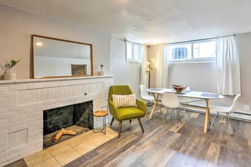 a living room with a table and a fireplace at Centrally Located Denver Townhome Near Dtwn in Denver