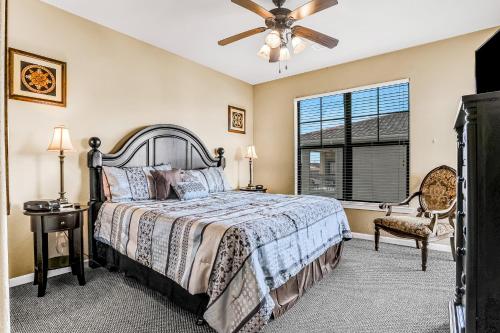 a bedroom with a bed and a ceiling fan at Bella Piazza Getaway in Davenport
