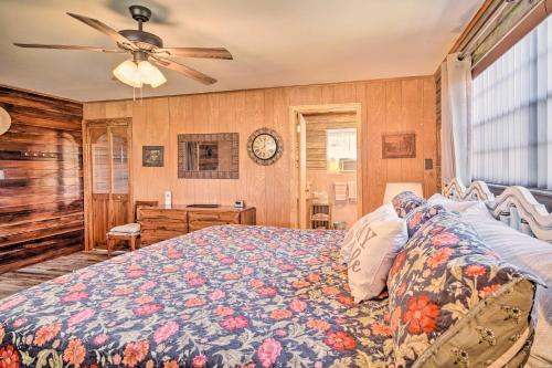 a bedroom with a bed and a ceiling fan at Cozy Lake Charles Studio with Golf Course Views in Lake Charles
