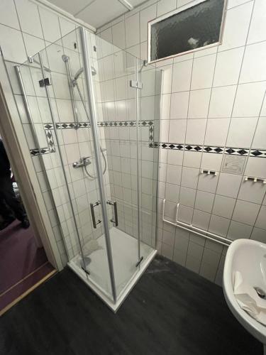 a bathroom with a shower and a toilet and a sink at Corso in Bad Wilsnack