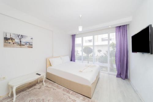 Postel nebo postele na pokoji v ubytování Pleasant Residence Flat with Balcony in Konyaalti