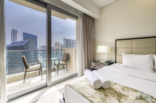 Postel nebo postele na pokoji v ubytování Upscale Studio at The Address Residences Dubai Marina by Deluxe Holiday Homes