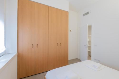 Postel nebo postele na pokoji v ubytování Easylife - Milano - Meravigli 16C - Duomo
