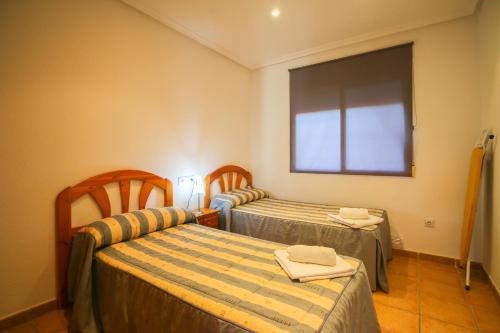 A bed or beds in a room at El Rinconcito