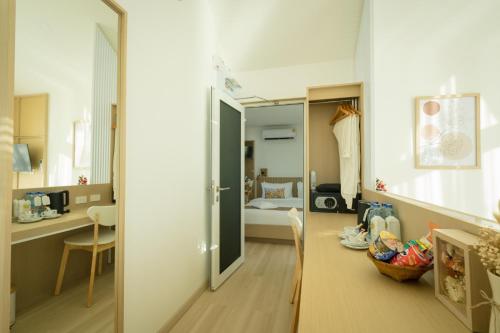Postel nebo postele na pokoji v ubytování Saksiam Lakeside Resort