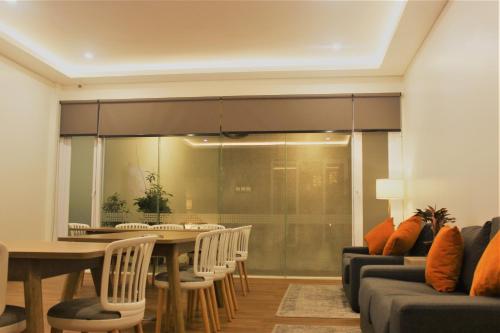 a dining room with a table and chairs at Treehouse Suites - Boutique Serviced Apartment in Jakarta