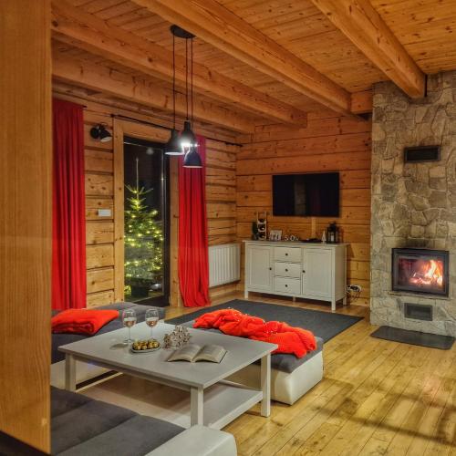 Et tv og/eller underholdning på LK Resort Łapsze domy z prywatną balią i sauną