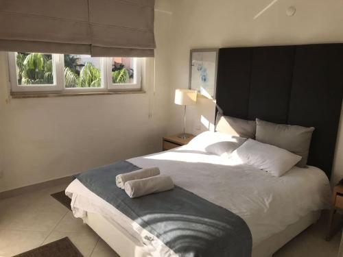 Ένα ή περισσότερα κρεβάτια σε δωμάτιο στο Whyndam Residences Kusadası Golf&Spa