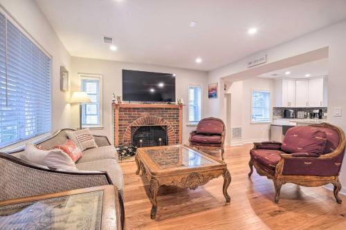 a living room with a couch and a fireplace at Washington, DC, Vacation Rental By Arboretum in Washington, D.C.