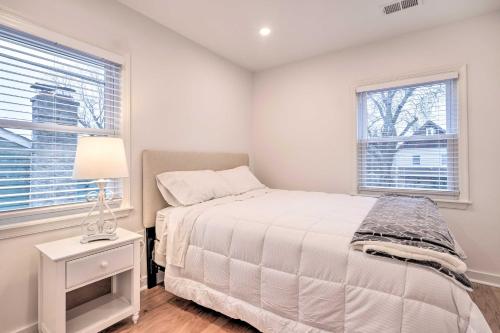 a white bedroom with a bed and a window at Washington, DC, Vacation Rental By Arboretum in Washington