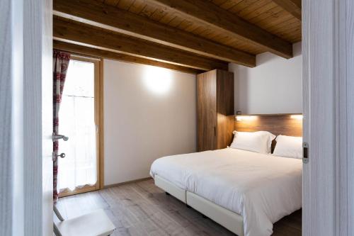 Postel nebo postele na pokoji v ubytování Residence Villa Brioschi