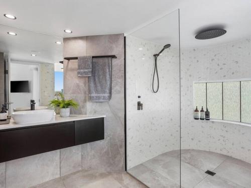 a bathroom with a sink and a shower at New 2 Bedroom 2 Bathroom Apartment in Gold Coast