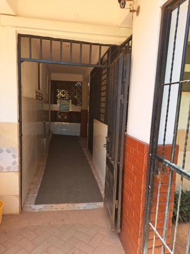 an entrance to a building with an open door at Kwale Golden Guest House in Kwale