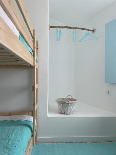 a bedroom with bunk beds and a window at New! Casa do Mar - Pedralva - Sagres- Surf & Nature in Vila do Bispo