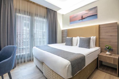 a hotel room with a bed and a window at The Omiya Hotel in Istanbul