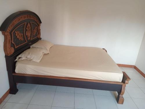 Giường trong phòng chung tại Asri Homestay Ponorogo
