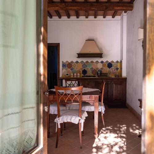 a dining room with a table and chairs at Il Borgo Di San Michele in Papigno