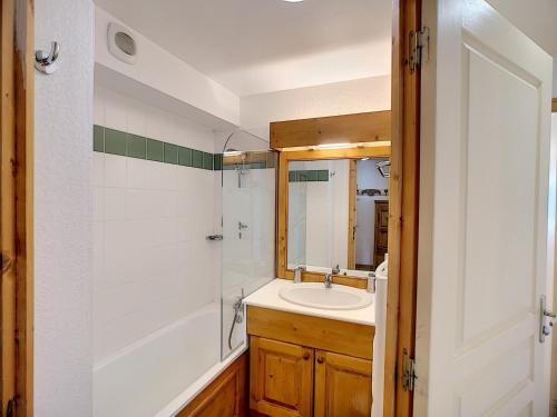 a bathroom with a sink and a shower at Appartement Les Menuires, 3 pièces, 6 personnes - FR-1-178-319 in Les Menuires