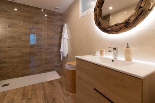a bathroom with a sink and a shower and a mirror at Room in Guest room - Private room in the fishing port of Marbella in Marbella