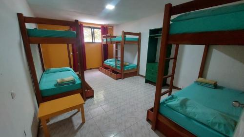 Postel nebo postele na pokoji v ubytování Surf House Hostel