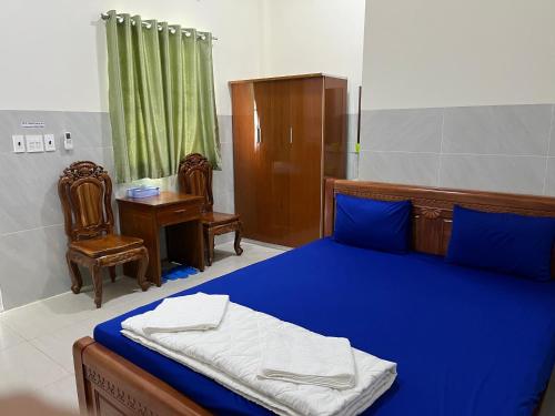 Katil atau katil-katil dalam bilik di Khách sạn Hoàng Gia - TT Lai Vung