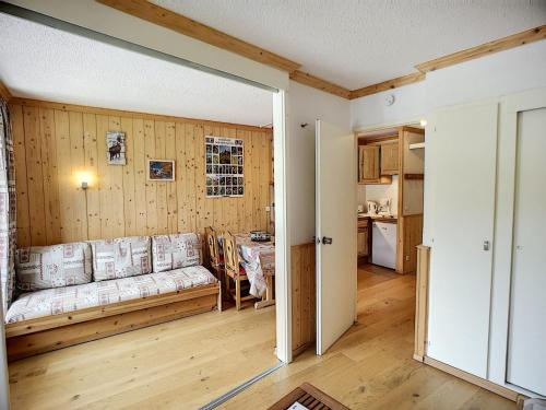 a living room with a couch and a table at Appartement Les Menuires, 2 pièces, 4 personnes - FR-1-178-181 in Les Menuires