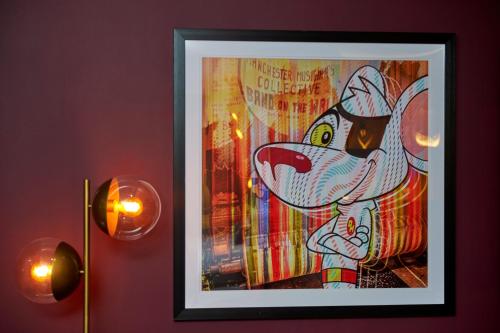 a picture of a cartoon dog on a wall at Malmaison Manchester in Manchester