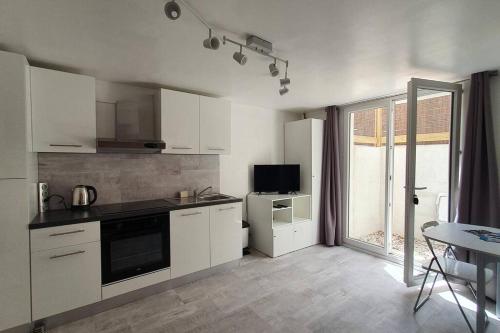 Kuchyňa alebo kuchynka v ubytovaní Appartement T2 à 500m de la plage et du marché.