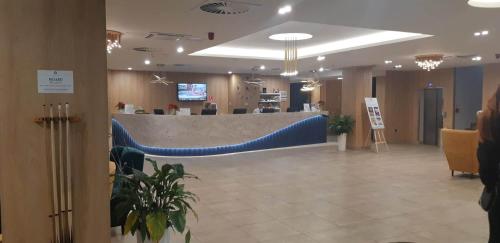 a lobby with a blue counter in a hospital at Apartmán GOLD Akvamarín in Bešeňová