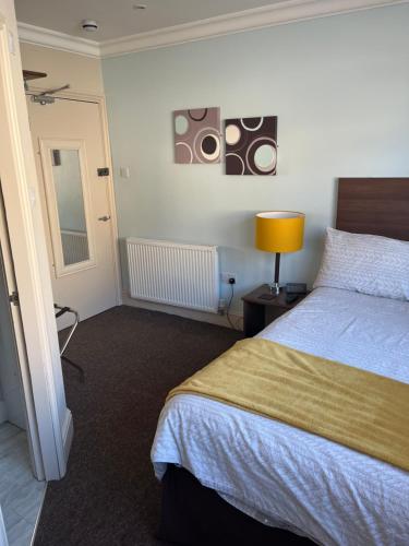 Ένα ή περισσότερα κρεβάτια σε δωμάτιο στο Armada Apartment