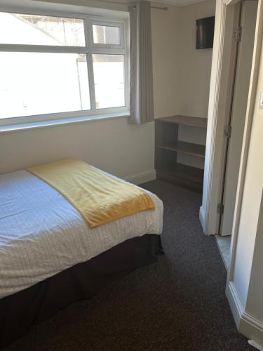 Ένα ή περισσότερα κρεβάτια σε δωμάτιο στο Armada Apartment