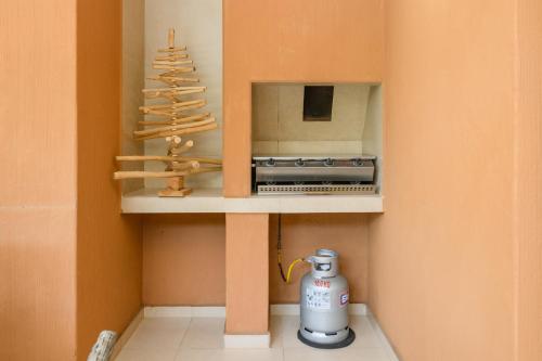 a toy kitchen with a mixer and a christmas tree at Villa 2811 Luxurious and Modern at Upmarket Golf and Beach Estate in Marina Beach