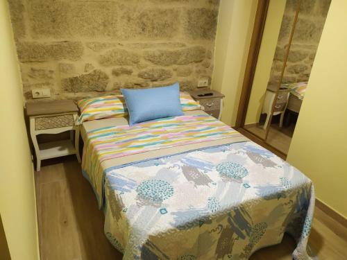 Ένα ή περισσότερα κρεβάτια σε δωμάτιο στο Casita Rural Puentesampaio