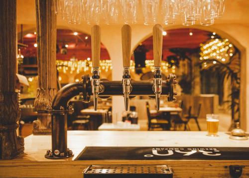 a bar with a beer tap in a restaurant at Trading Boundaries in Uckfield