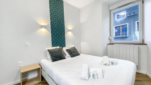 Katil atau katil-katil dalam bilik di HOMEY WALTER - Proche Gare - Balcon privé - Wifi