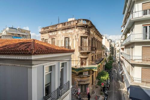 an old building in the middle of a city at OpenAir HOT TUB/Big Balcony/Great Boutique Apt in Athens