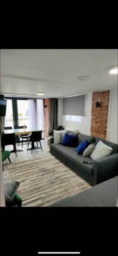 a living room with a couch and a table at The Captains Wheel in Skerries