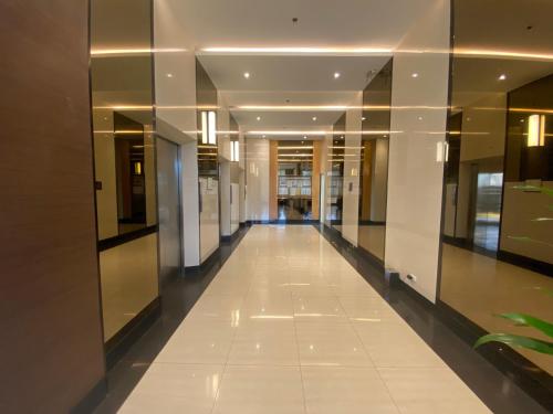 a hallway of a building with a long corridor at Compact Studio Unit @ Centrio Tower in Cagayan de Oro