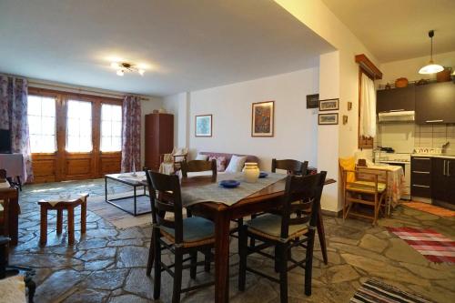 a kitchen and dining room with a table and chairs at Solon and Teo Summer House in Avdira beach in Paralía Avdhíron