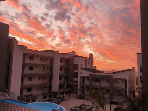 a sunset view from the balcony of a building at 38@Nivica in Langebaan