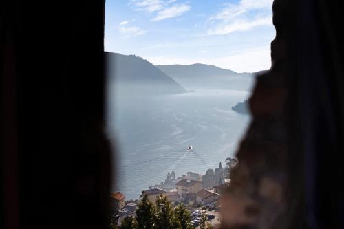 a view of the water from a window at Renovated Barn of the year 1500 in Moltrasio