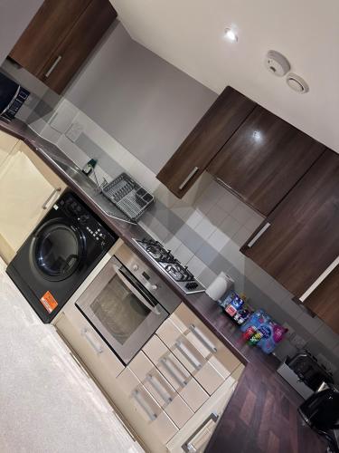 an overhead view of a kitchen with a stove top oven at Pier Road in London