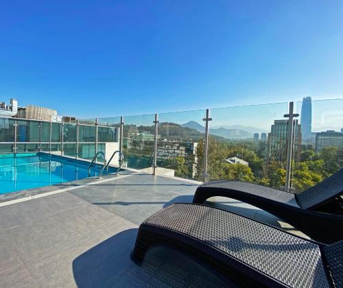 a balcony with a swimming pool on top of a building at hUB Providencia in Santiago