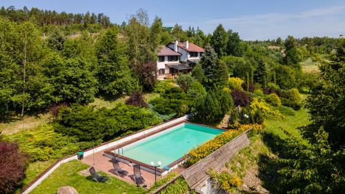 an aerial view of a house with a swimming pool at Jeleniec in Stara Rzeka