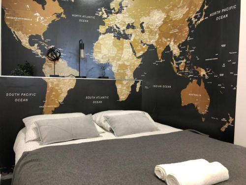 a bedroom with a large map of the world at Atelier Kersauson in Brest