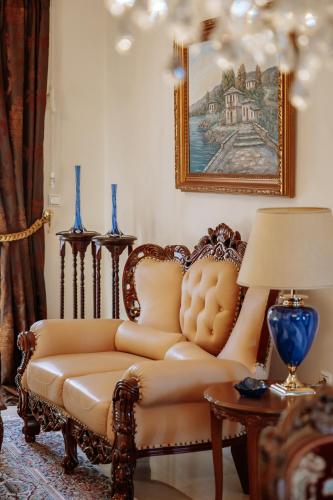 a living room with a couch and a table with a lamp at Friendly Flat 5 in Edessa